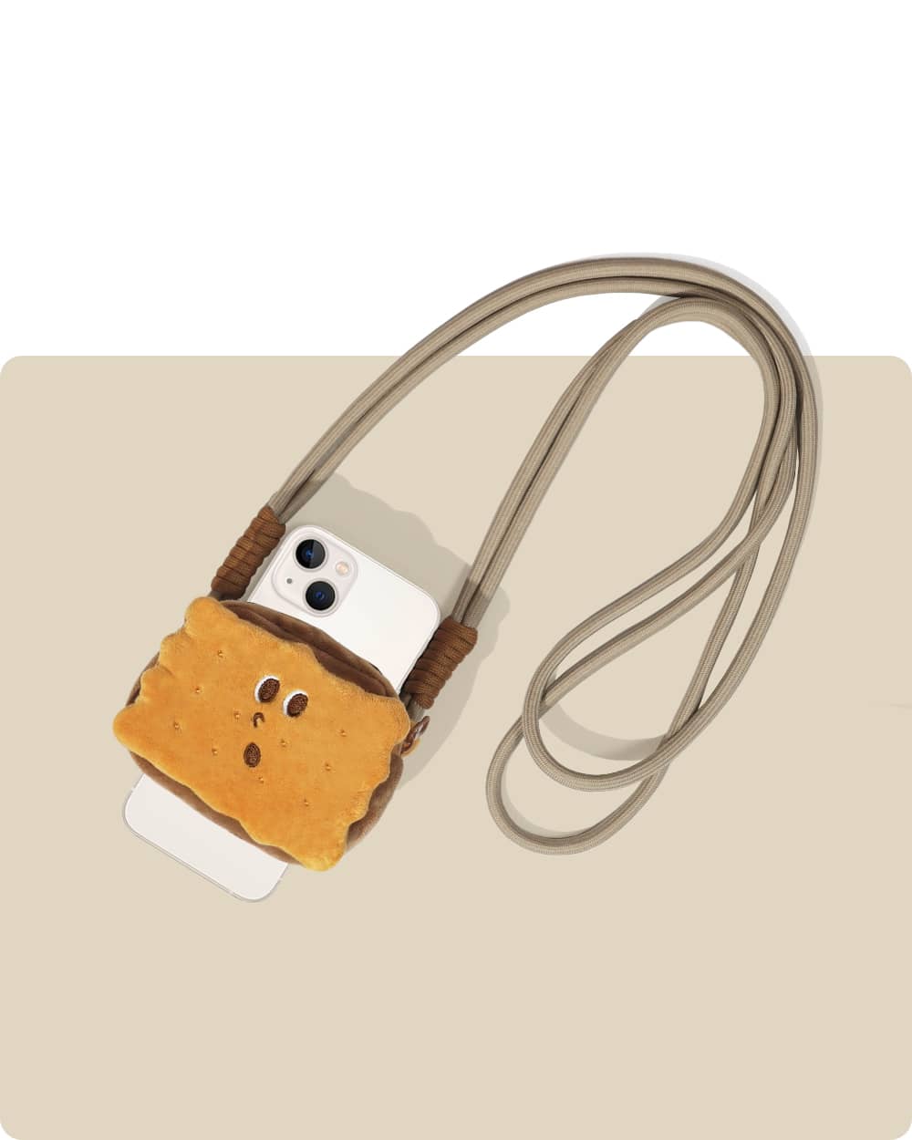 A crossbody phone rope with a cute, cartoon-style cookie design pouch. With 57cm in rope length, it is ideal for crossbody wear and use in daily dog walking